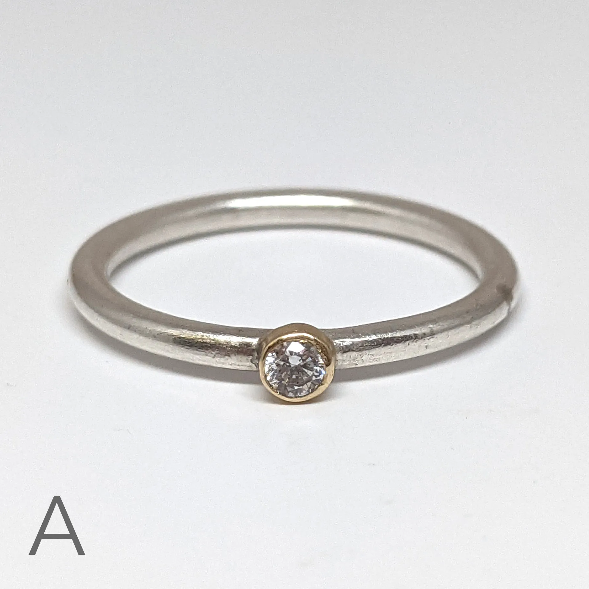 NEW! Moissanite with an 18kt Gold Bezel on a Sterling Silver Stacking Rings by Thea Izzi