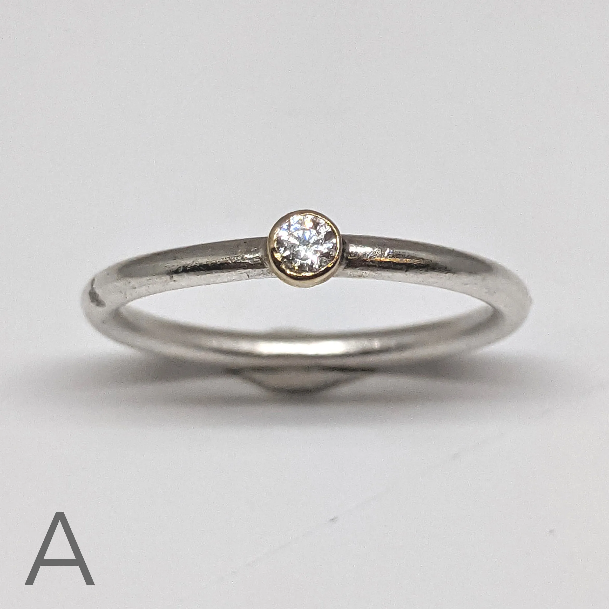 NEW! Moissanite with an 18kt Gold Bezel on a Sterling Silver Stacking Rings by Thea Izzi